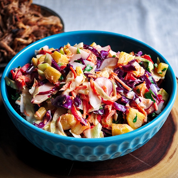 Tangy pineapple coleslaw with cabbage, carrots, and radishes