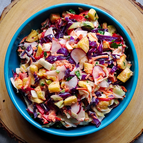 A bowl of pineapple coleslaw.