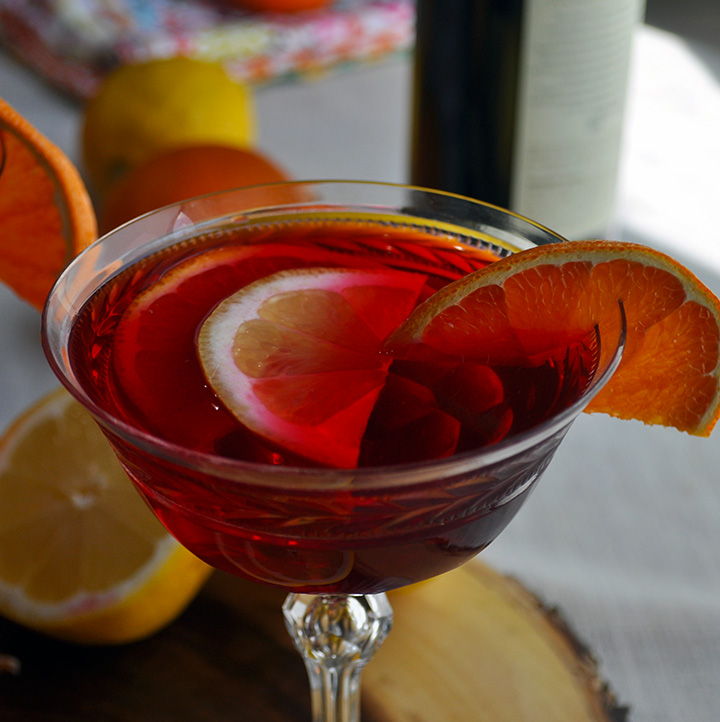 A glass of hibiscus tea sangria cocktail