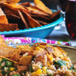 A plate of Southwest Quinoa Salad with tortilla chips.