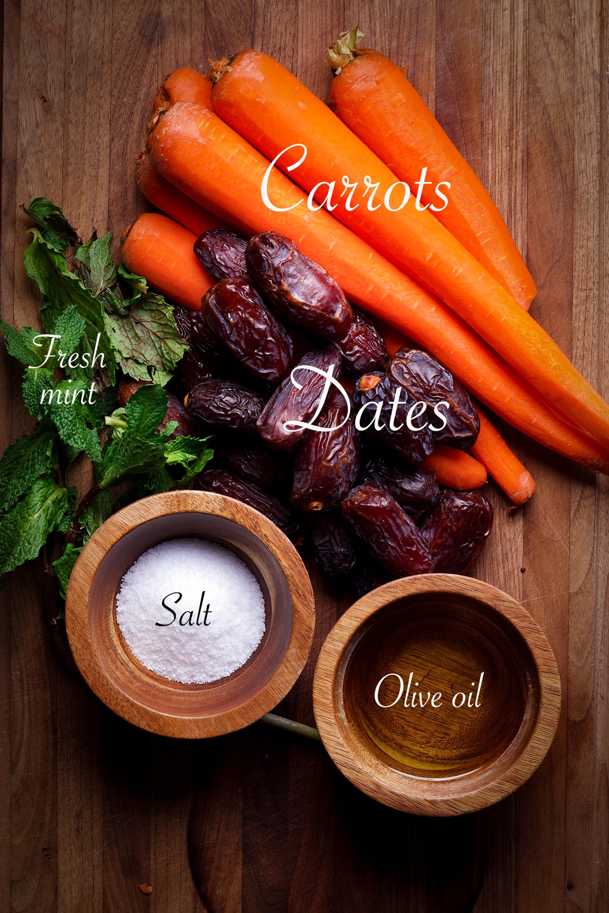 All the ingredients you need to prepare roasted carrots and dates.