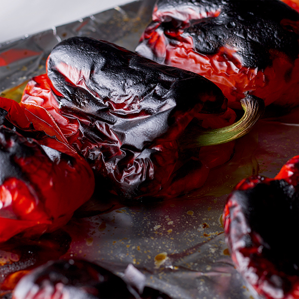 A tray of roasted red bell peppers.