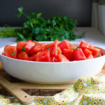 A bowl of savory watermelon salad with chili and lime.