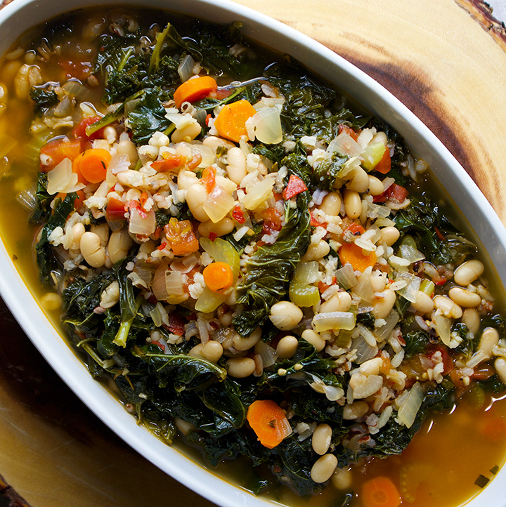 White bean and kale soup with wild rice and tomatoes.