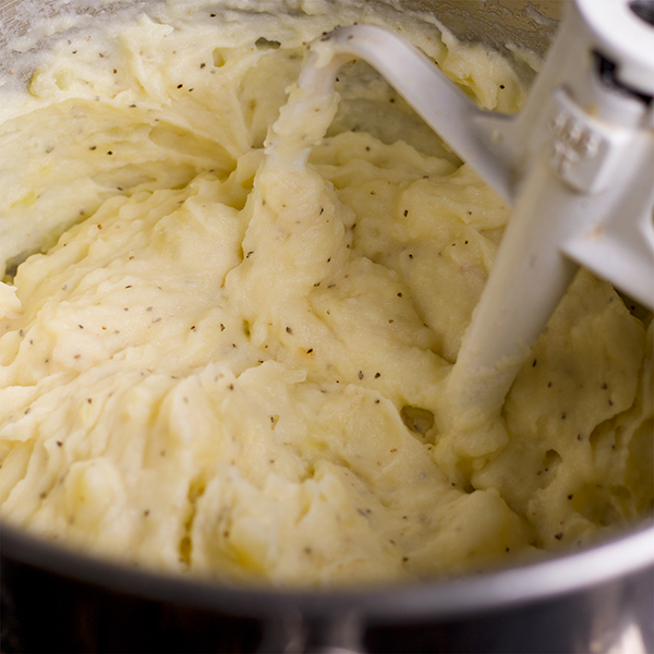 Making garlic mascarpone mashed potatoes.