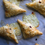 Cheese, bacon, date, and chipotle pepper turnovers.