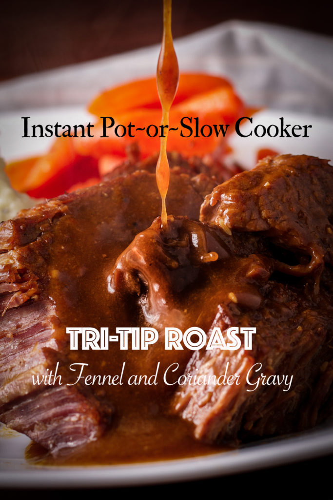 Someone pouring fennel and coriander gravy over a plate full of tender, cooked Tri Tip roast.