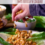 Sprinkling peanuts over chicken lettuce wraps.
