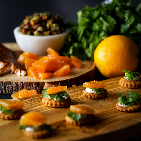 Building a tray of Orange Cedar Roasted Salmon Appetizers with Almond Chili Salsa