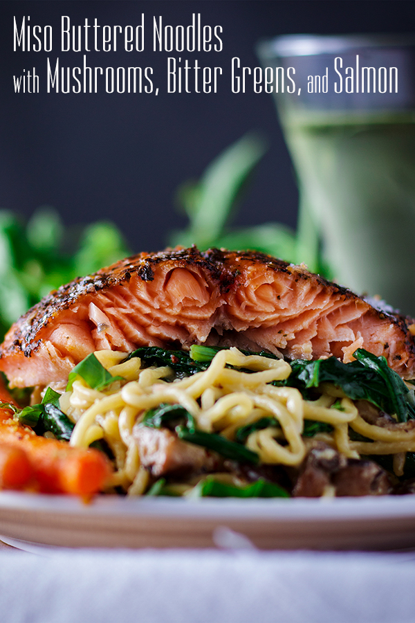 A plate of miso buttered noodles with salmon and vegetables.