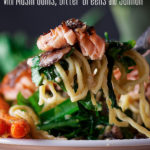 Taking a bite of miso buttered pasta with mushrooms and salmon