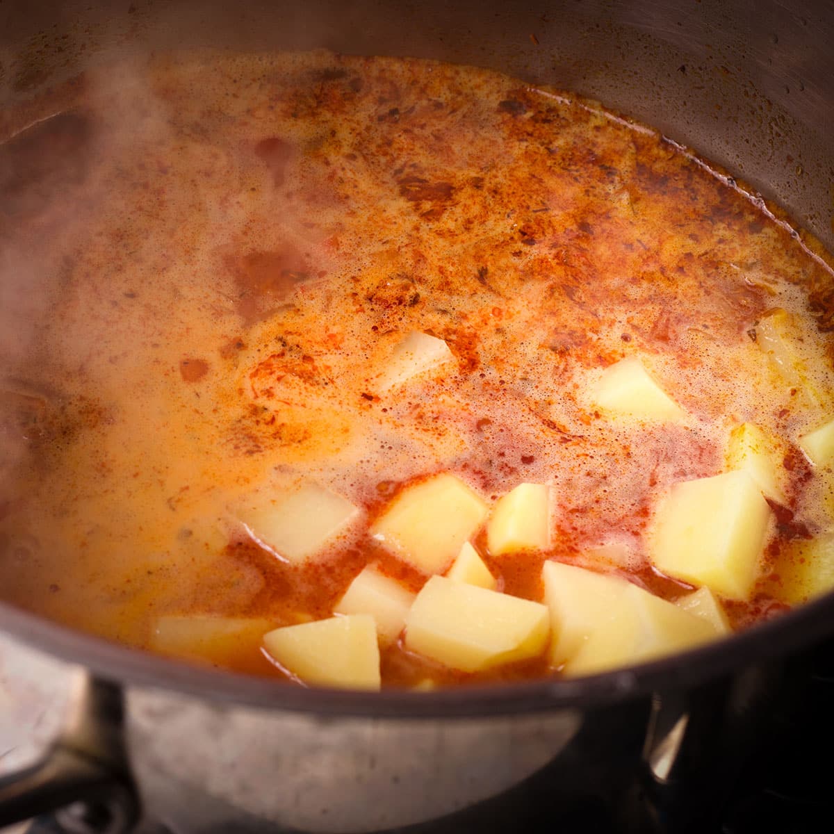 Add the potatoes to the broth.