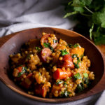 Couscous grain bowls with butternut squash and andouille sausage.