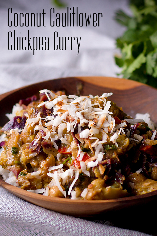 A bowl of vegetarian cauliflower chickpea curry with coconut.