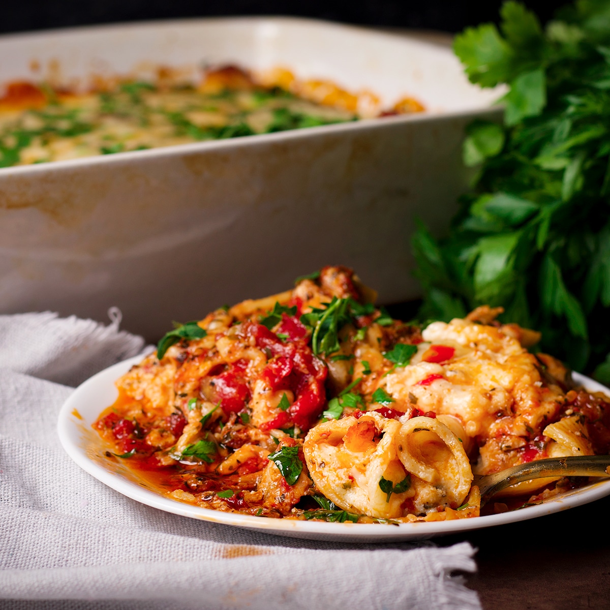 A plate filled with three cheese ricotta stuffed shells with homemade marinara.