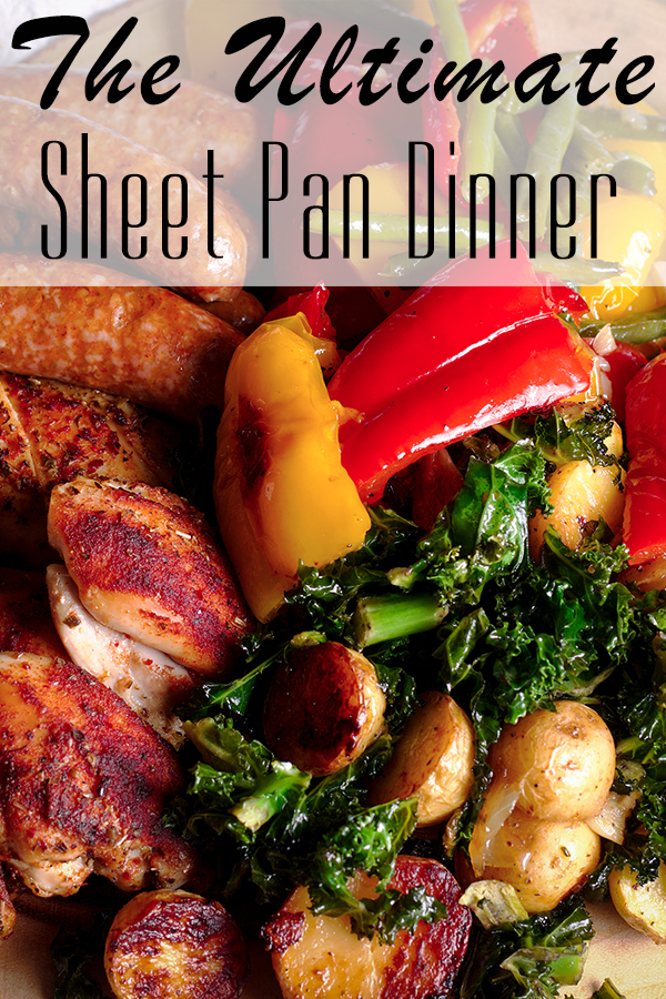 The Ultimate Sheet Pan Dinner with chicken, sausage, and several different kinds of vegetables, on a platter, ready to serve.
