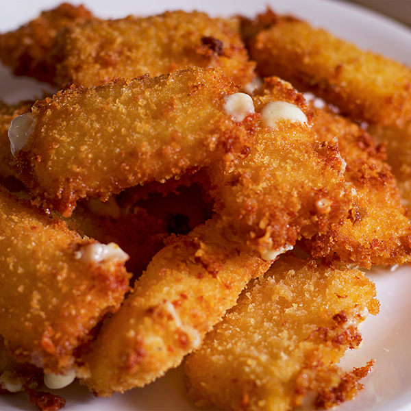 A plate of breaded fried cheese.