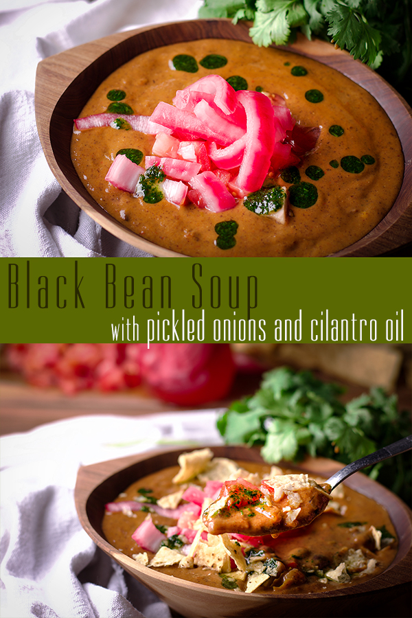 Bowls of Black Bean Soup topped with pickled onions and cilantro oil.