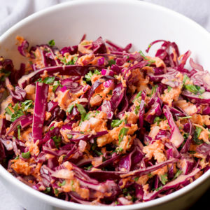 Cabbage slaw in a bowl, ready to serve.