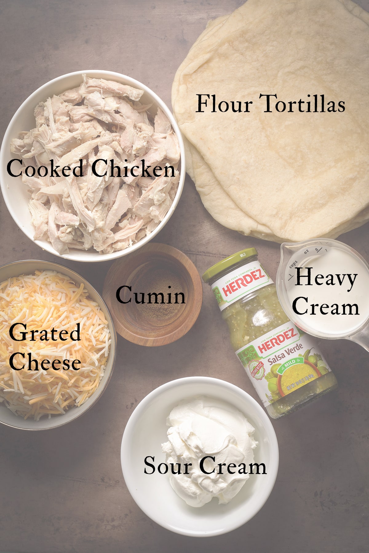 All the ingredients needed to make a pan of chicken enchiladas verdes.