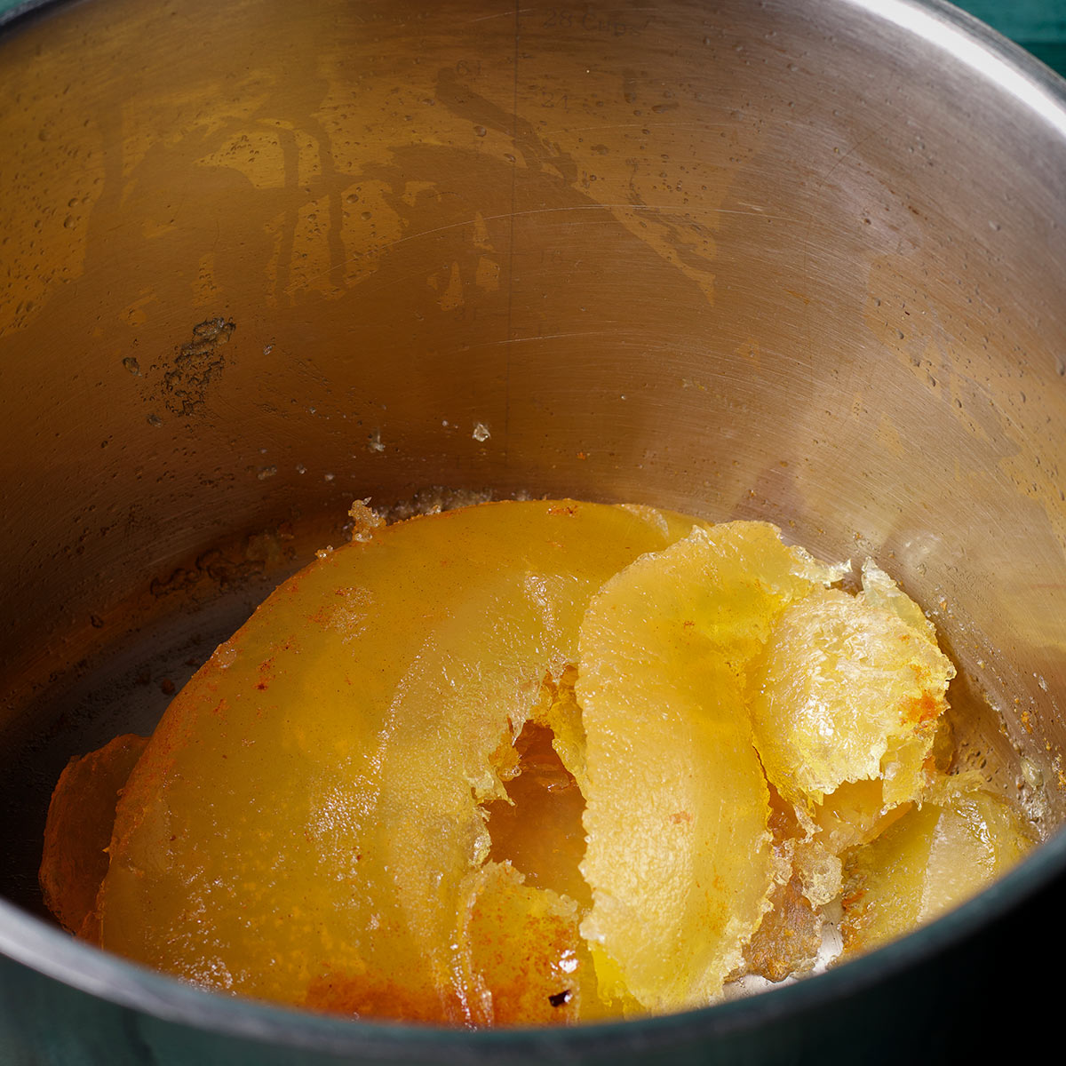A stock pot containing used frying oil that has been turned to solid waste with a product called Fry Away.