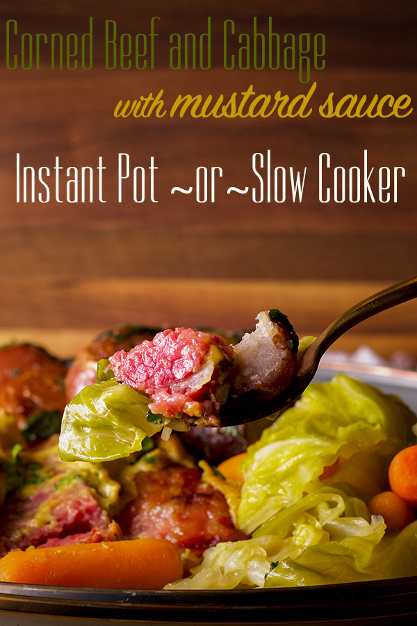 Taking a bite of corned beef and cabbage with parsley buttered potatoes.