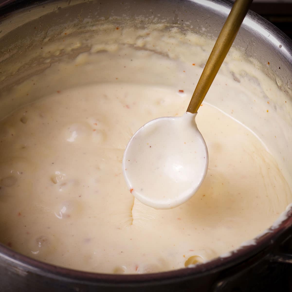 Bechamel sauce that's thick enough to completely coat a spoon that has been dipped in the sauce.