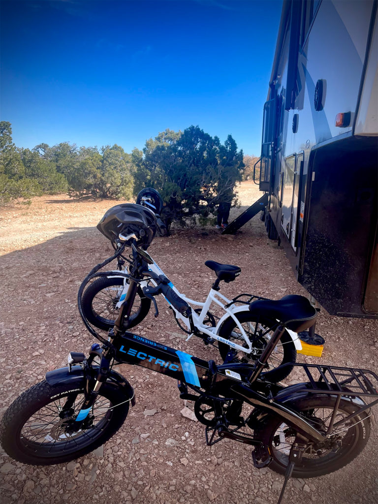 Our two Lectric eBikes parked outside our 5th wheel RV.