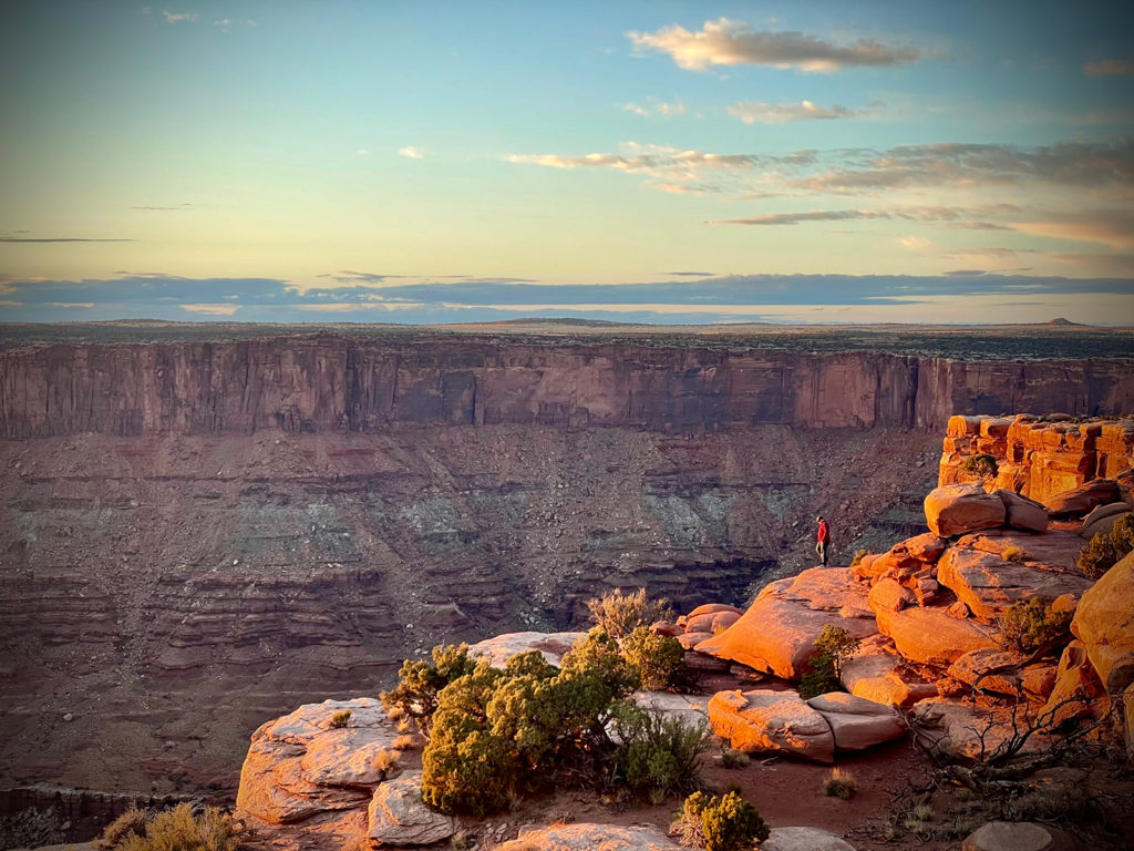 Walking along the cliff edge at Dead Horse Point State Park in Utah.