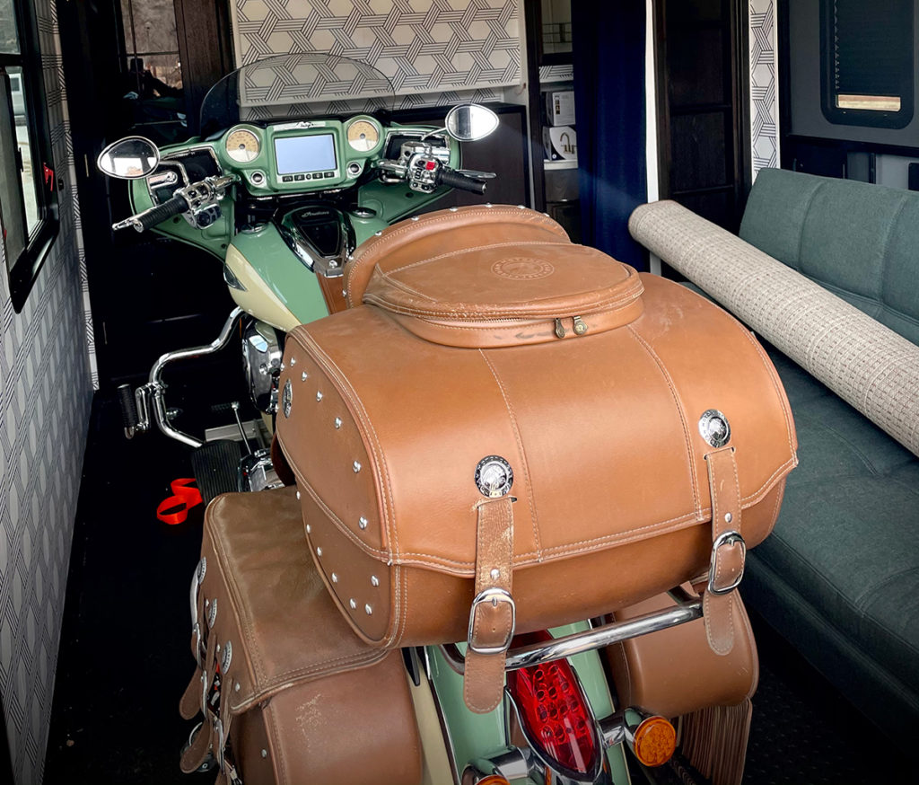 Our motorcycle inside the garage of our 5th wheel RV.