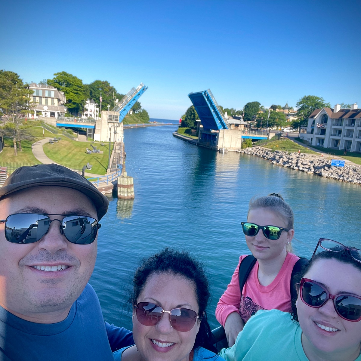 Steve and I with our daughter and niece on a ferry to Beaver Island as it leaves the coast of Charlevoix. In the background, you can see the drawbridge opening up for our passage.