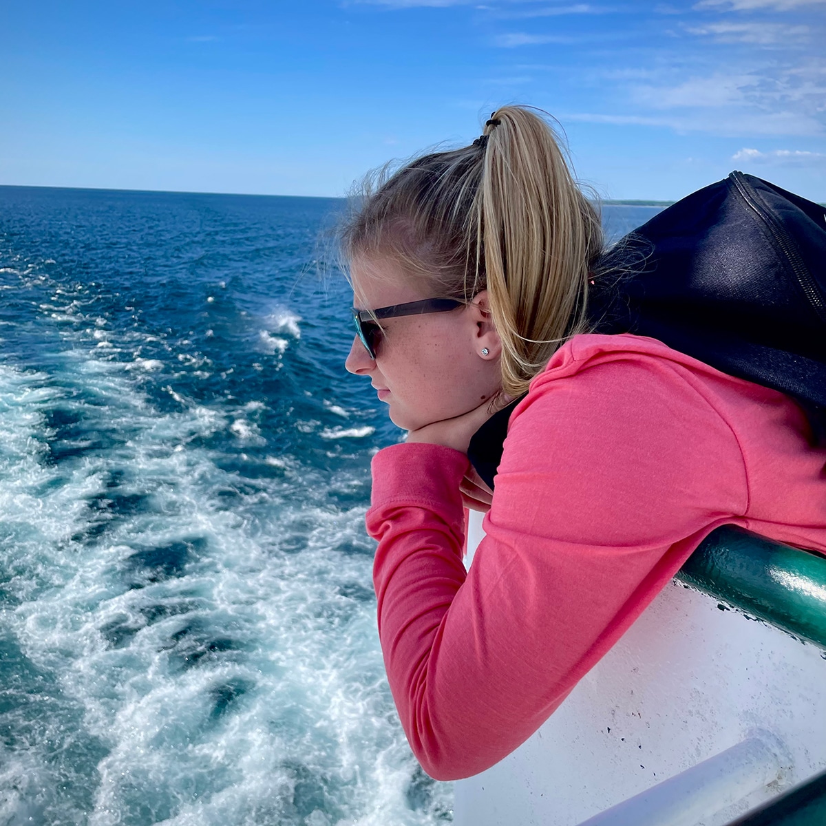 Our niece looking over the edge of the ferry from Charlevoix to Beaver Island in Michigan.