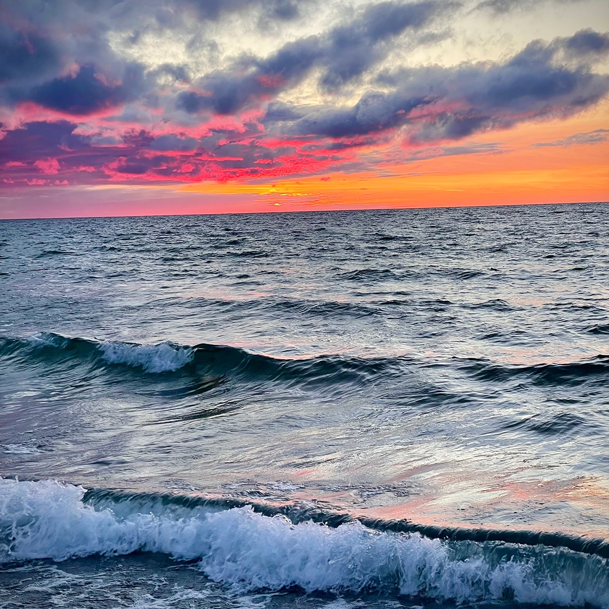 A brilliant sunset over the water of Lake Michigan in Petoskey.