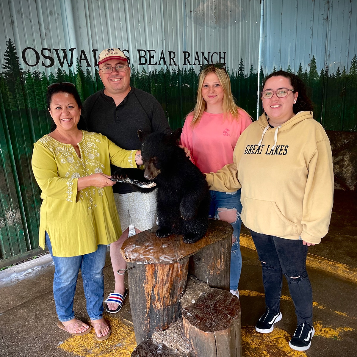 Steve and I with our niece and daughter feeding the a baby bear at Oswald's Bear Ranch in Michigan's UP.