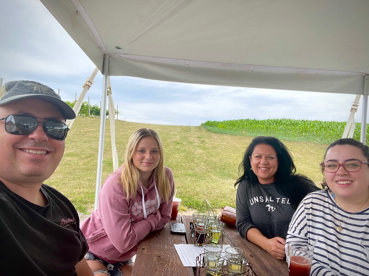 Steve and I with our daughter Kate and our niece at the Royal Farms Farmer's Market and Winery sampling several different kinds of hard cider.