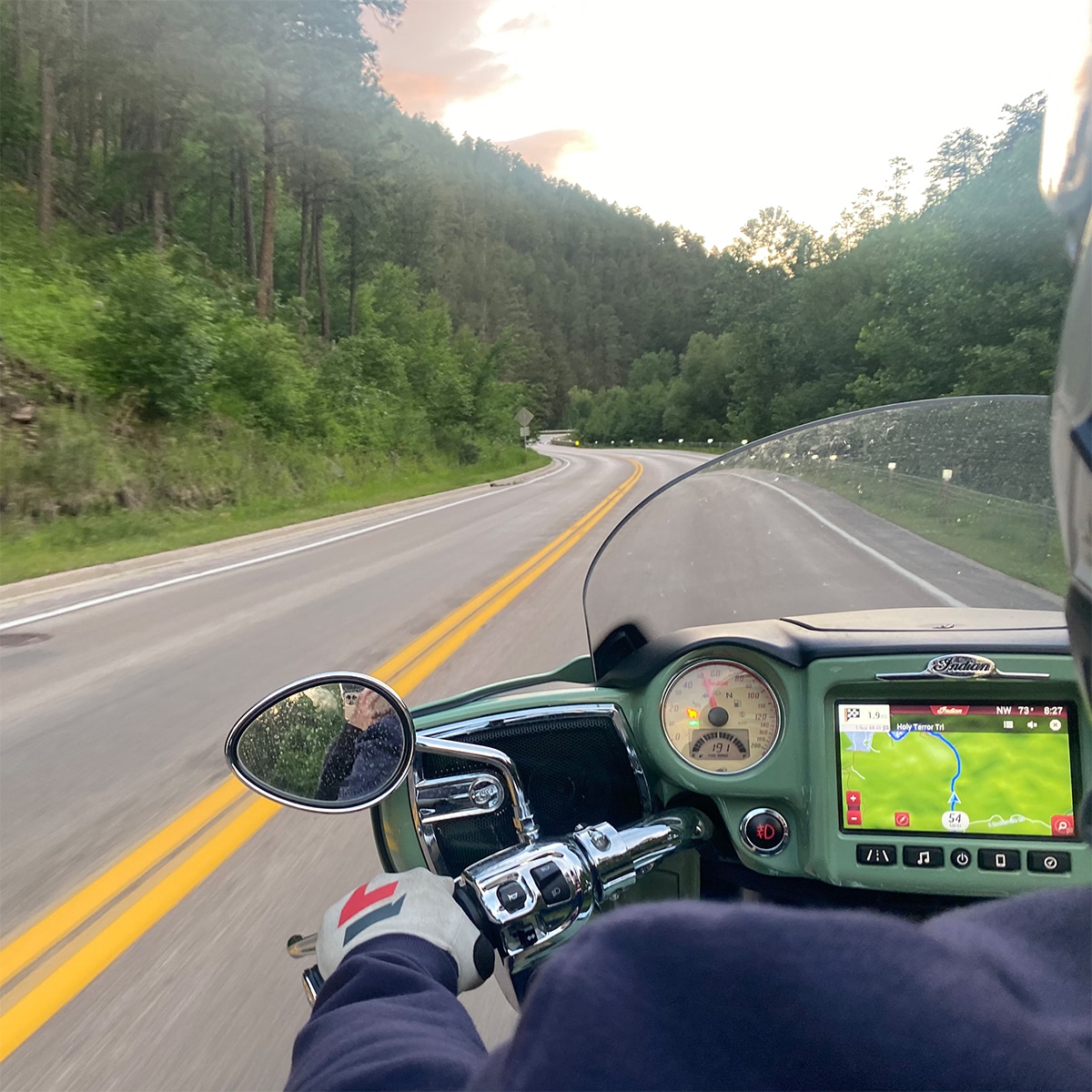 Riding through the Black Hills of South Dakota on a motorcycle.