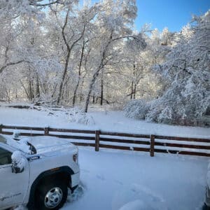 Our truck and RV covered in snow while parked in a Colorado campground.