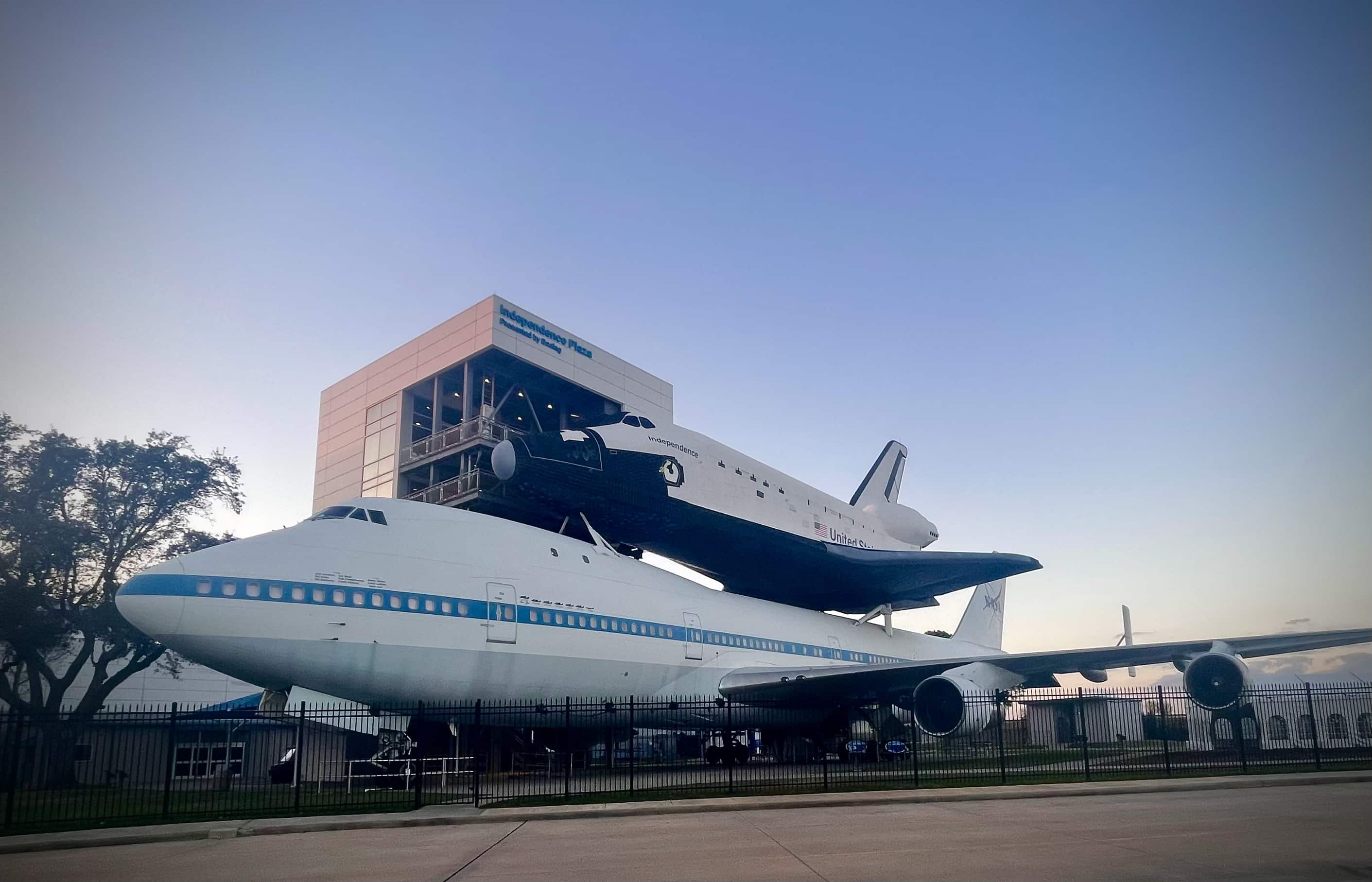 The space shuttle atop it's carrier plane outside the Houston Space Center.