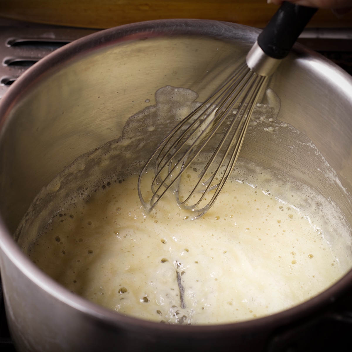 Flour and butter cooking in a saucepan on the stovetop to make a roux.