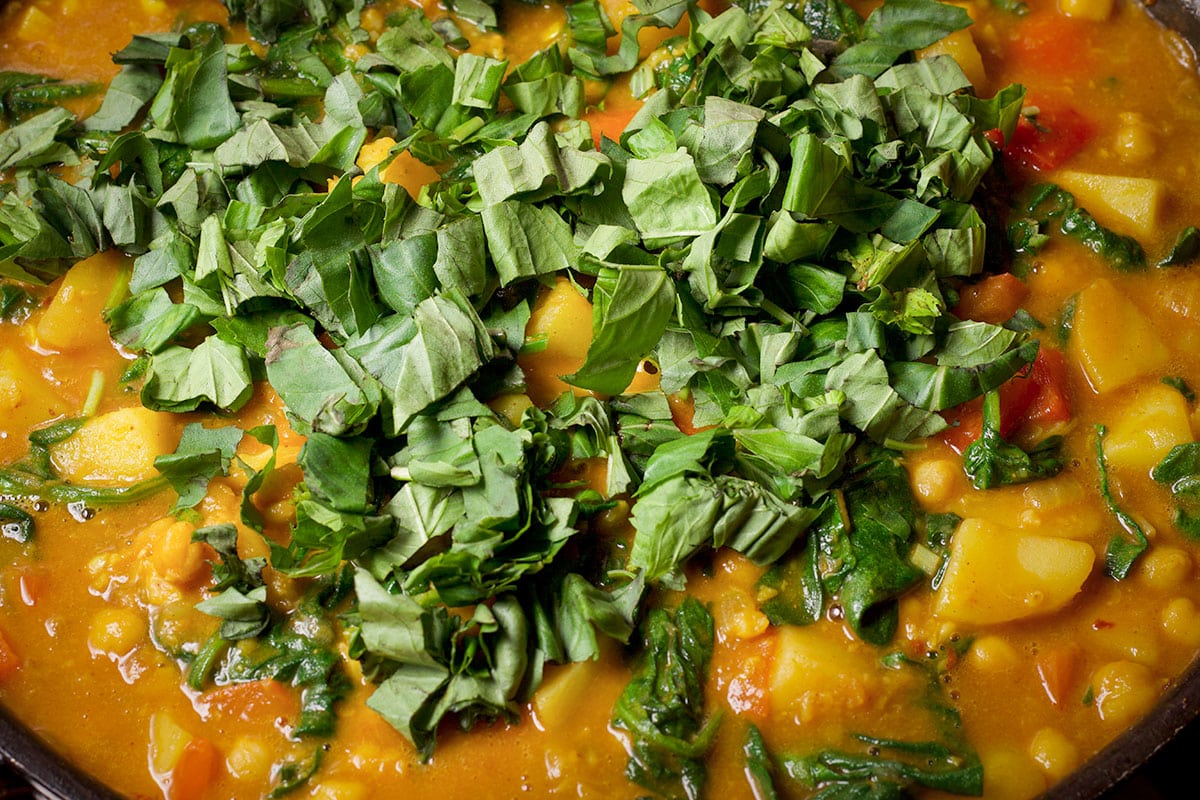 Add fresh basil to the curry right before serving.