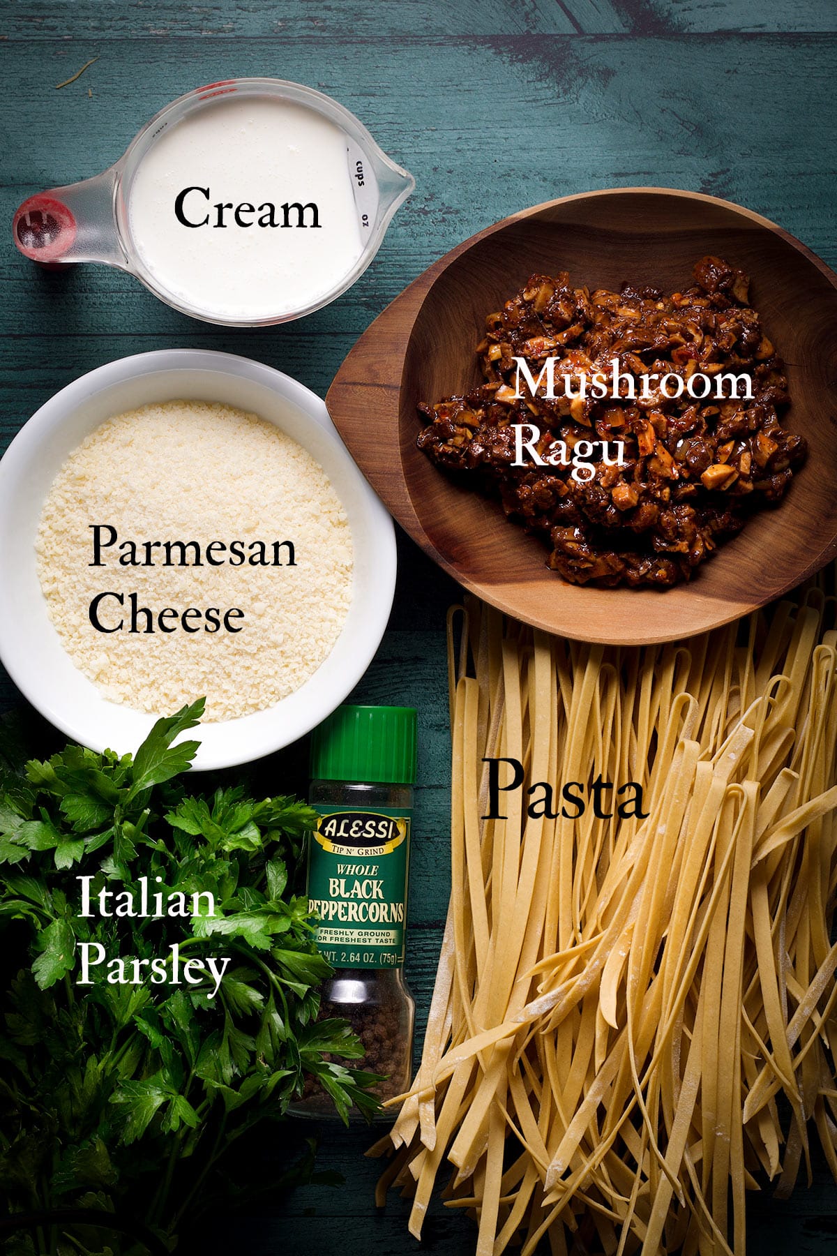 All the ingredients needed to make creamy mushroom pasta.
