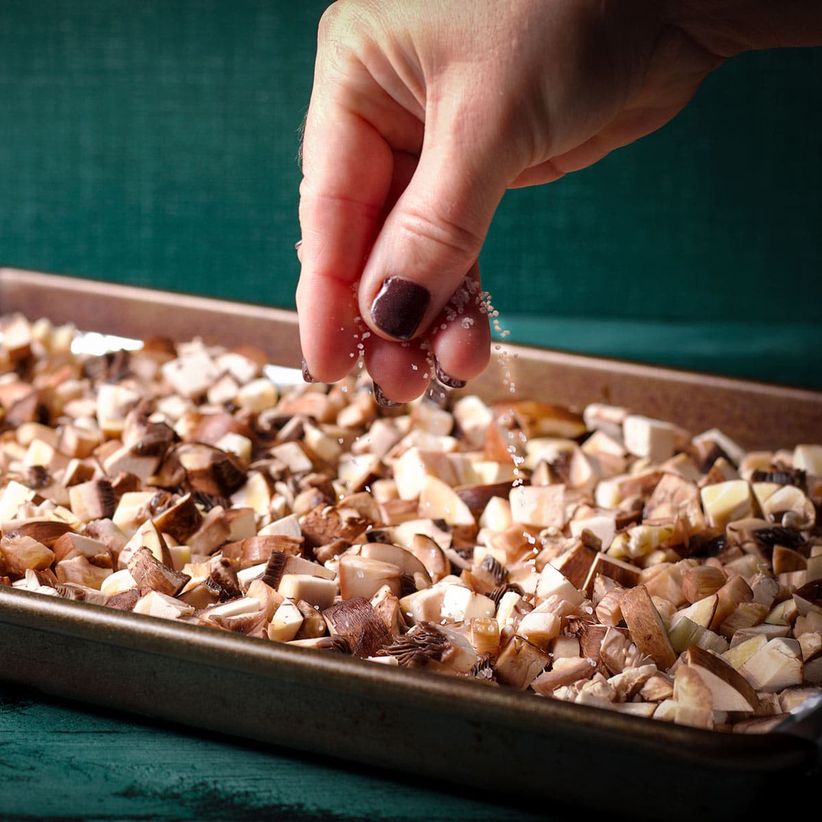 Sprinkle salt over the mushrooms before roasting.