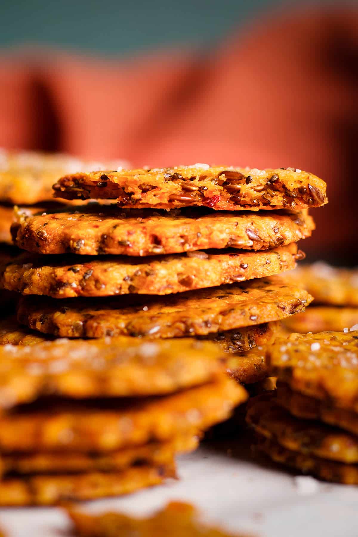 A stack of gluten free cheddar and almond crackers.
